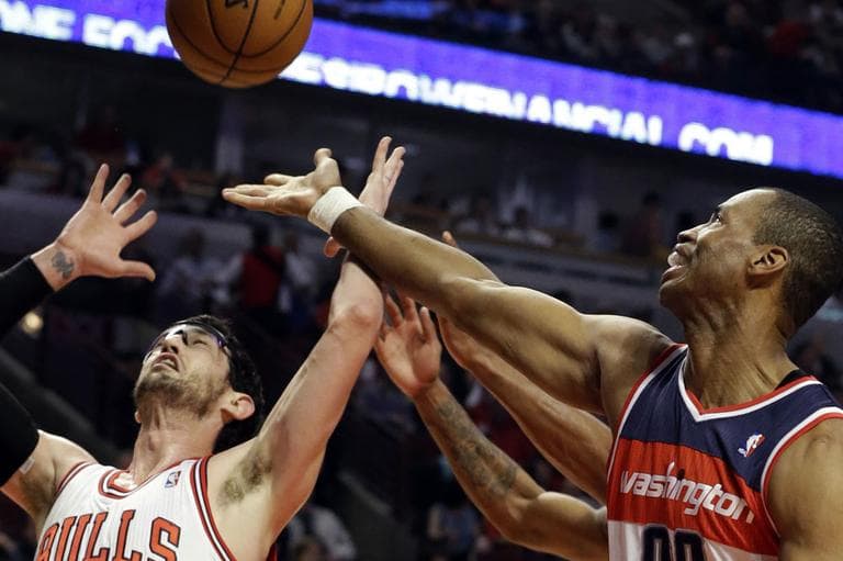 In a Wednesday, April 17, 2013 file photo, Washington Wizards center Jason Collins, right, battles for a rebound against Chicago Bulls guard Kirk Hinrich during the first half of an NBA basketball game in Chicago. (AP)