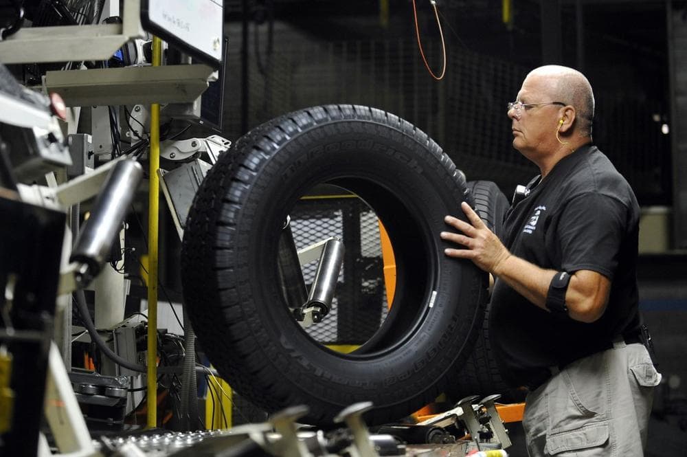 In this Tuesday, July 24, 2012, photo, tire inspector Buddy Rice checks for defects in the tire verification area at a Michelin manufacturing plant in Greenville, S.C. (AP)