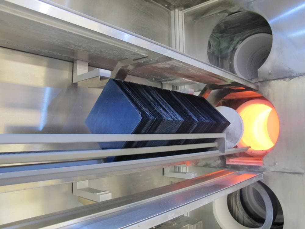 Solar wafers are baked in an industrial oven as part of 1366 Technologies' manufacturing process. (Curt Nickisch/WBUR)