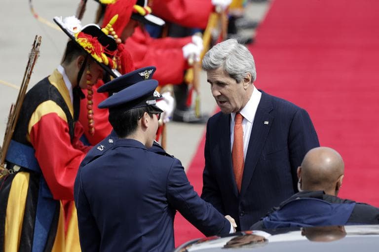 U.S. Secretary of State John Kerry, right, shakes hands with unidentified South Korean Air Force soldiers upon his arrival at Seoul military airport in Seongnam, South Korea, Friday, April 12, 2013. (AP)