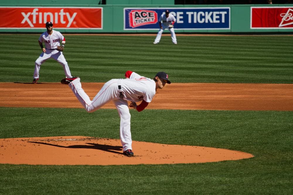 Red Sox pitcher Clay Buchholz throws the first pitch of 2013 in Fenway Park. (Jesse Costa/WBUR)
