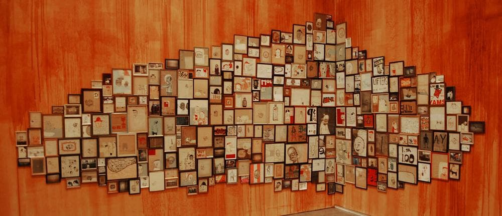 Dense displays of ex-votos that McGee saw at Brazilian church in 1993 inspired his cluster installations, like this one from 1998. (Greg Cook)