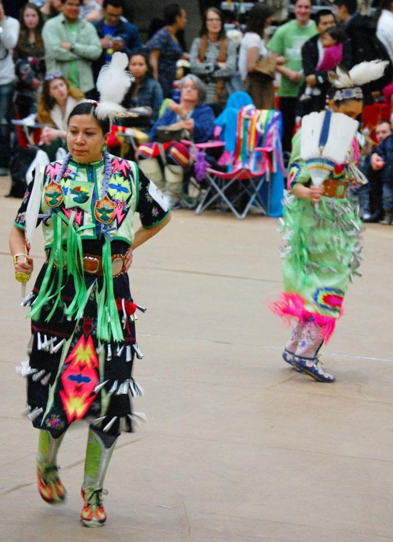The jingle dress dance is characterized by the ringing of tin cones sewn onto the women's dresses. The sound is &quot;meant to ward off evil spirits,&quot; organizers say. (Greg Cook)