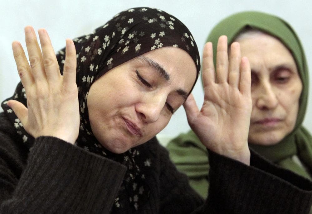 Zubeidat Tsarnaeva, the mother of the two Boston bombing suspects, speaks at a news conference as her sister-in-law, Maryam, listens in Makhachkala, in the southern Russian province of Dagestan, Thursday, April 25, 2013. The suspects&#039; father, Anzor Tsarnaev, said Thursday that he is leaving Russia for the United States in the next day or two, but their mother said she was still thinking it over. (Musa Sadulayev/AP)