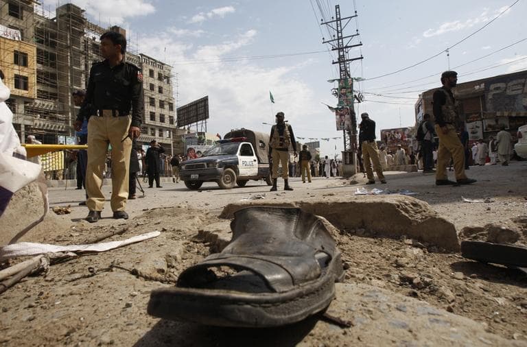 Pakistani police officers cordon off the site of attack in Peshawar, Pakistan on Monday, April 29, 2013. A suicide bomber targeting policemen killed at least 6 people in northwestern Pakistan on Monday in the latest attack ahead of next month's parliamentary election, police said. (Mohammad Sajjad/AP)