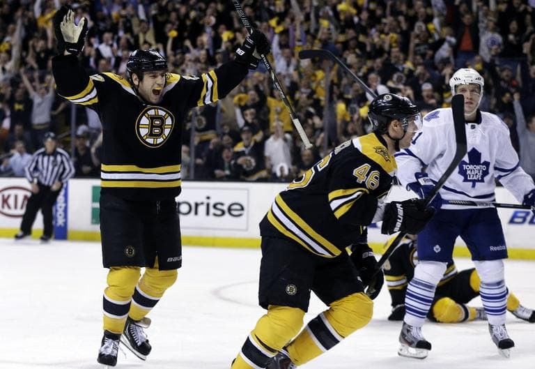 Bruins left wing Milan Lucic, left, celebrates a goal scored by center David Krejci (46) as Toronto Maple Leafs left wing Nikolai Kulemin (41) looks on during the second period. (AP/Elise Amendola)