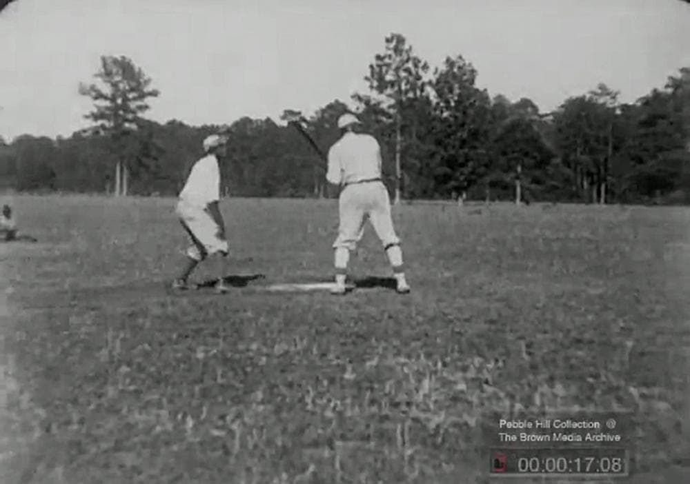 A screen shot from an early video depicting African-American baseball players on a Georgia plantation. (Pebble Hill Plantation Film Collection/AP)