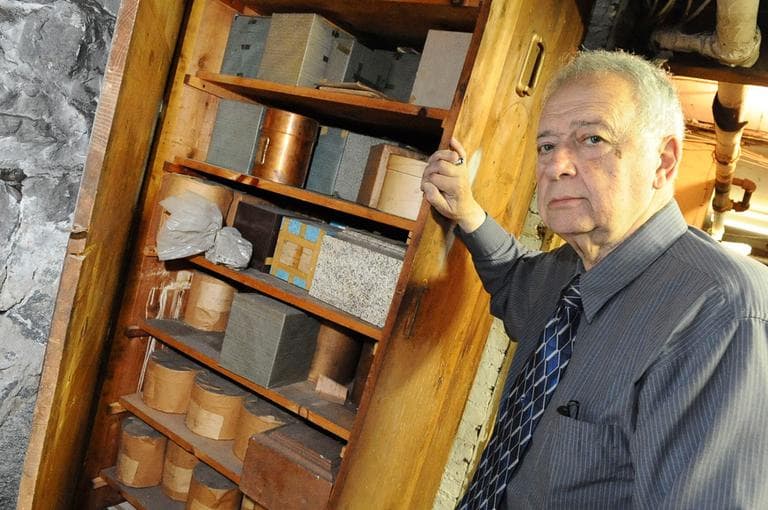 Worcester funeral director Peter Stefan poses next to boxes of unclaimed ashes for an unrelated 2008 news story. (Lisa Poole/AP)