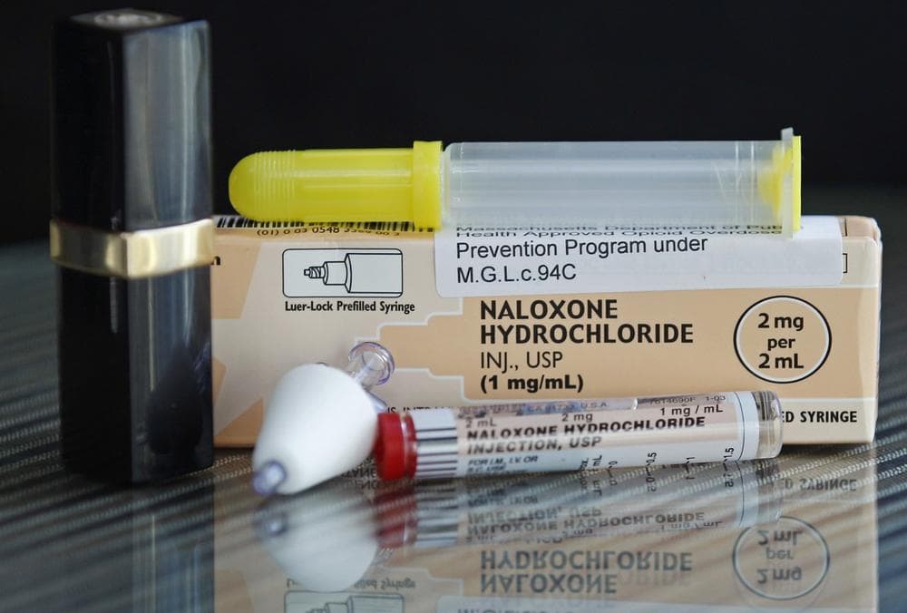 A tube of Naloxone Hydrochloride, also known as Narcan, is shown for scale next to a lipstick container. (AP)