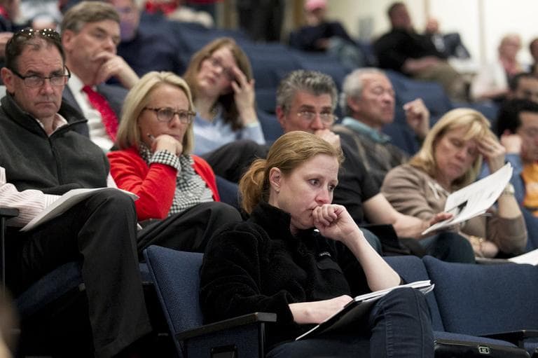 Audience members listened as One Fund administrator Kenneth Feinberg outlined how initial funds would be distributed at a town hall meeting at the Boston Public Library Monday. ( Yoon S. Byun/The Boston Globe/Pool/AP)
