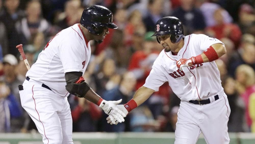 Shane Victorino is congratulated by David Ortiz after hitting a solo home run in the 4th inning (AP).