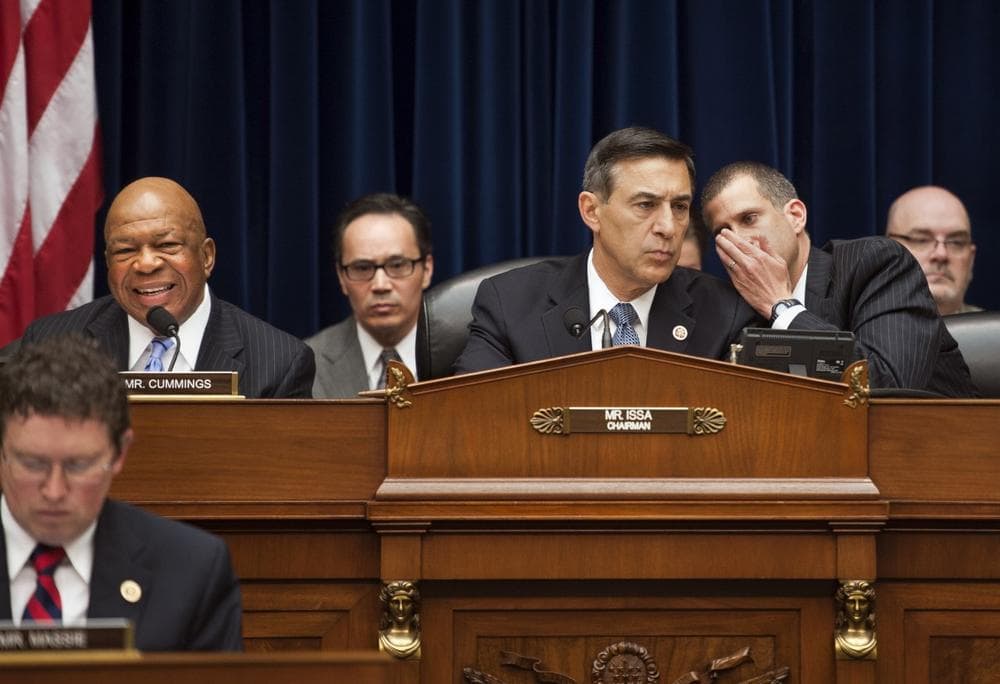 House Oversight and Government Reform Committee Chairman Rep. Darrell Issa, R-Ca., center, confers with committee general counsel Stephen Castor, right, as Rep. Elijah Cummings, D-Md., makes his opening statement of the hearing on Benghazi on Capitol Hill in Washington, Wednesday. (AP)