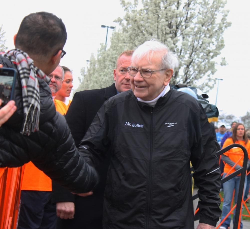 Warren Buffett shook hands with shareholders and fans after firing the starter's pistol at the &quot;Invest in Yourself&quot; 5K race. (Robyn Murray/Only A Game)