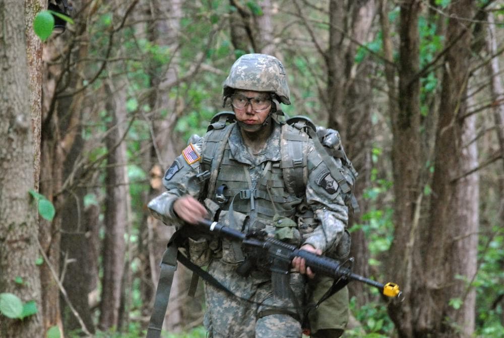 Capt. Sara Rodriguez of the 101st Airborne Division walks through the woods during the expert field medical badge testing at Fort Campbell, Ky. (AP)