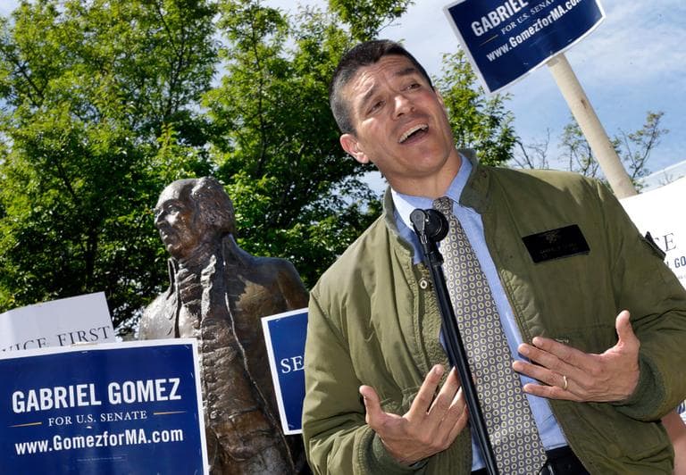 Senate candidate Gabriel Gomez campaigns in front of the John Adams statue in Quincy Thursday. (Elise Amendola/AP)
