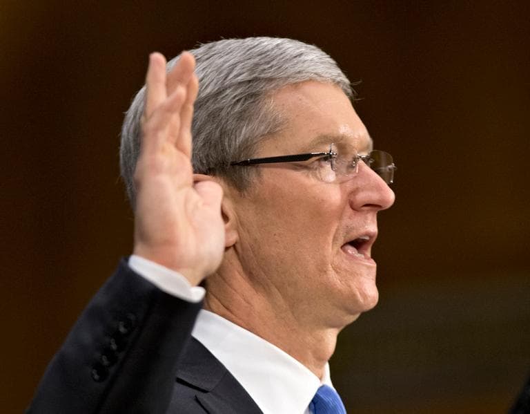 Apple CEO Tim Cook is sworn in on Capitol Hill in Washington, Tuesday, May 21, 2013, prior to testifying before the Senate Homeland Security and Governmental Affairs Permanent subcommittee on Investigations hearing. (J. Scott Applewhite/AP)