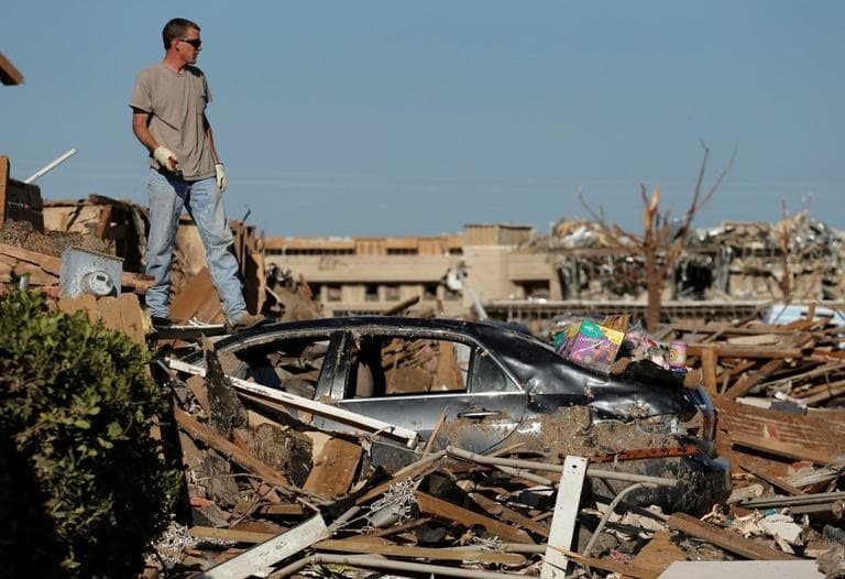 Ben Osborne surveys the scene as he sorts through his tornado-ravaged home Wednesday, May 22, 2013, in Moore, Okla. (Charlie Riedel/AP)