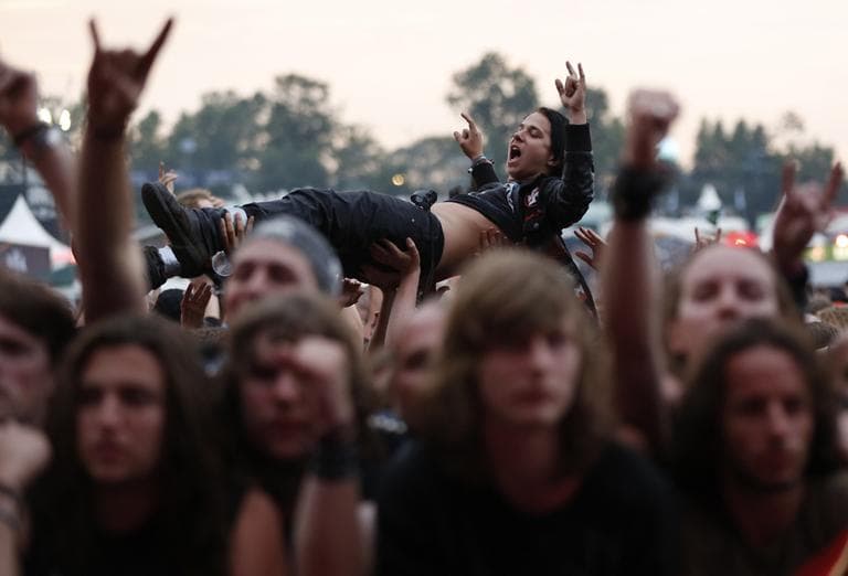 A metal fan crowd surfs in a mosh pit during the heavy metal festival Wacken Open Air in Germany. (Philipp Guelland, DAPD/AP)