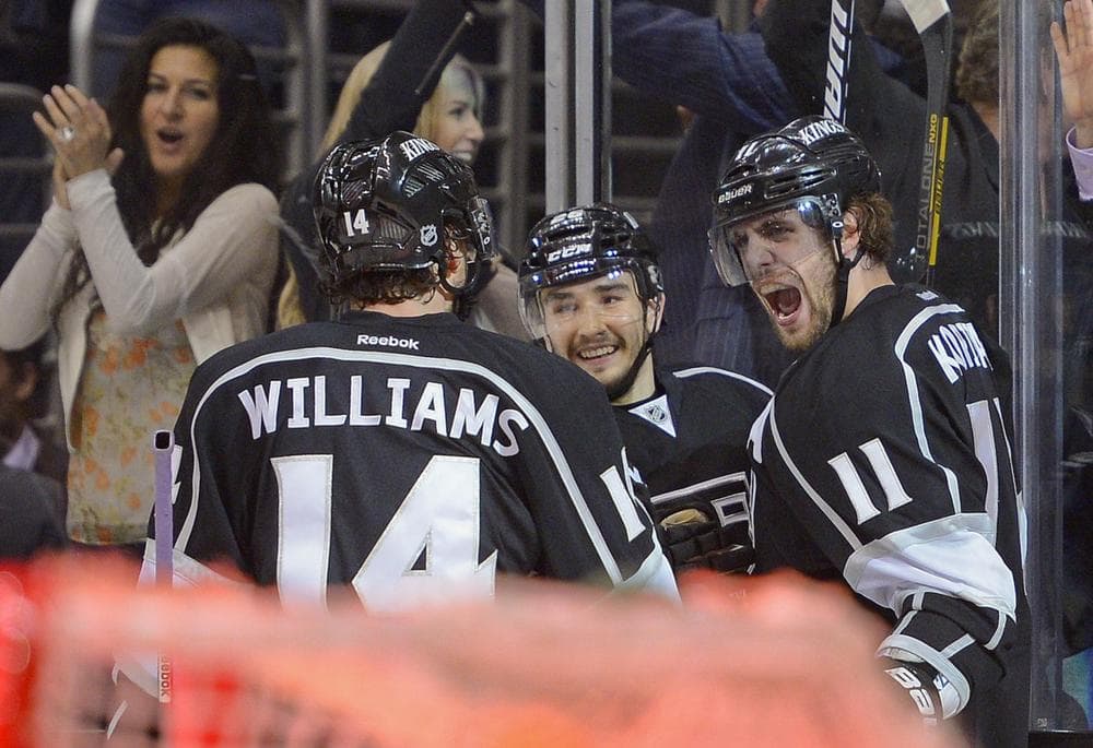 Kings players celebrate after scoring during Game 5 of the Western Conference semifinals. So far this postseason, the Kings are perfect at home. (Mark J. Terrill/AP)