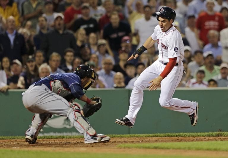 Red Sox' Jacoby Ellsbury heads to home plate before he is tagged out by Cleveland Indians catcher Yan Gomes, on a single by Dustin Pedroia. (AP/Charles Krupa)