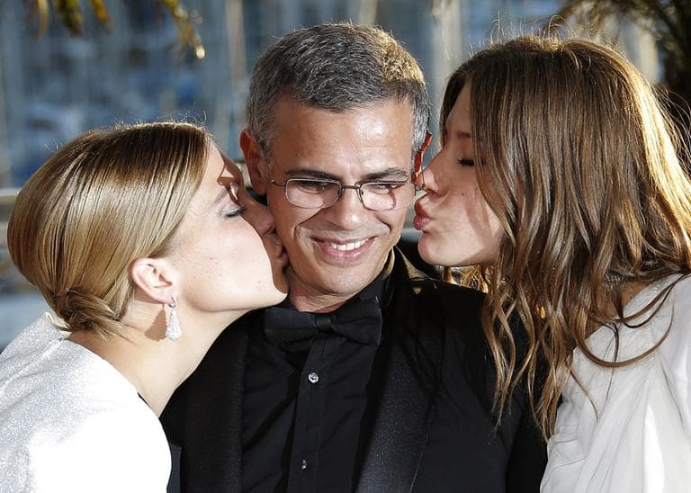 Actress Lea Seydoux, left, director Abdellatif Kechiche, centre, and Adele Exarchopoulos pose with the Palme d&#039;Or award for the film La Vie D&#039;Adele after an awards ceremony at the 66th international film festival, in Cannes, southern France, Sunday, May 26, 2013.  (Lionel Cironneau/AP)
