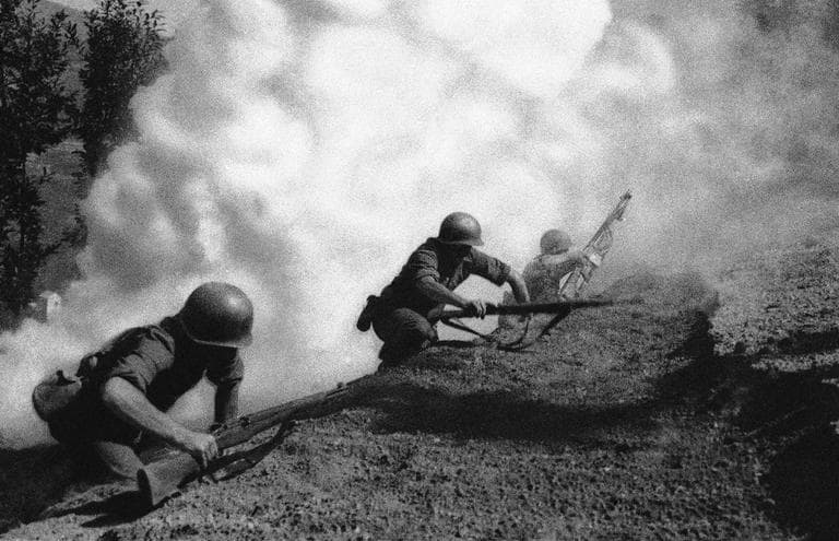 Rangers serving with the Fifth United States Army advance up a hillside in Italy under cover of smoke, with the object of clearing the Germans from the hills, in this undated photo. (AP) 