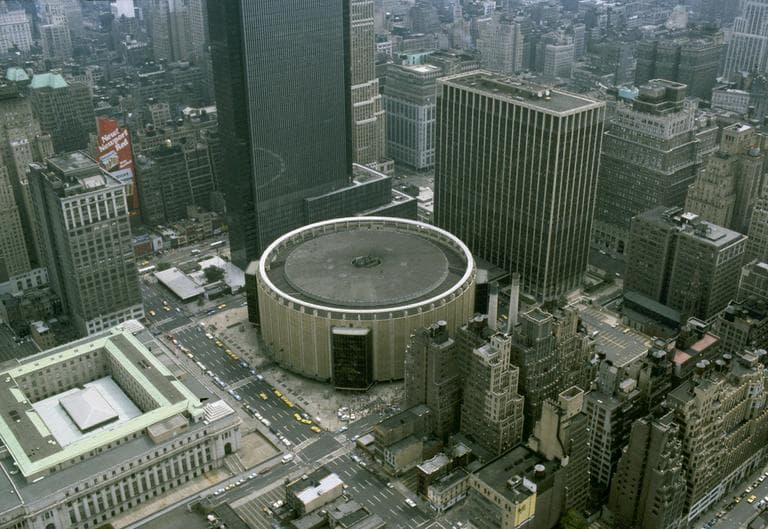 Madison Square Garden, which sits on top of Penn Station, is the round building in the center of this undated modern photo. (AP)