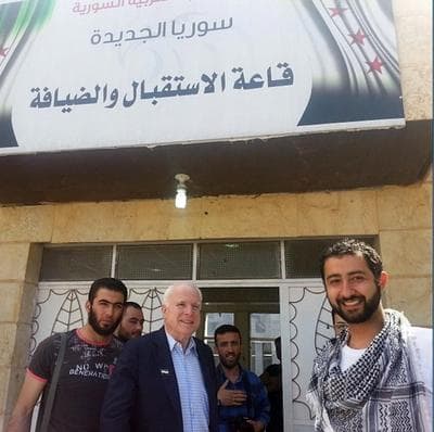 Sen. John McCain, R-Ariz., center, accompanied by Mouaz Moustafa, right, visits rebels in Syria on Monday, May 27, 2013. (Mouaz Moustafa/Syrian Emergency Task Force via AP)