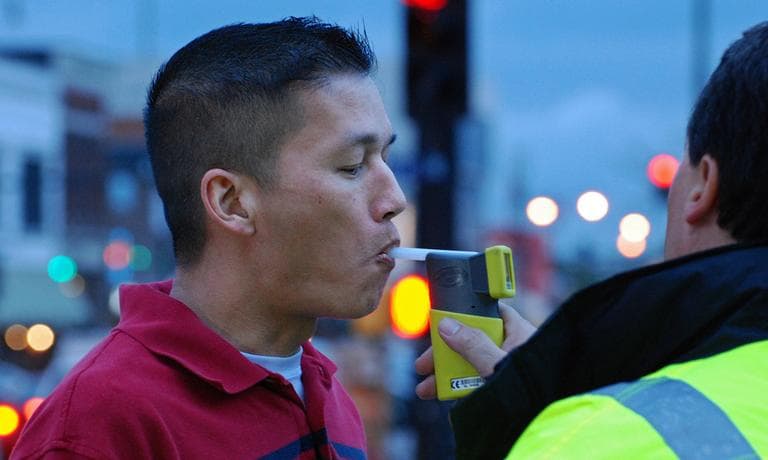 Tim Uong takes a Breathalyzer test at “Know Your Limit” in Columbia, Mo., on Friday, April 26, 2013. He says the event helped him learn how much one beer would affect his blood alcohol content level. (Ashleigh Jackson, KOMU News/Flickr)