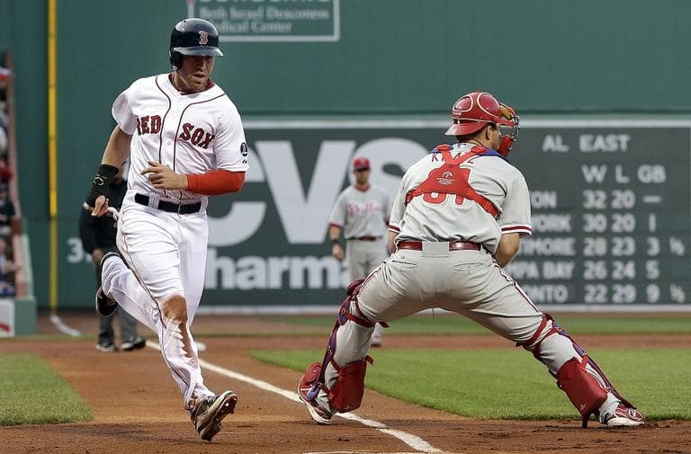 Red Sox's Jacoby Ellsbury scores on a single by Dustin Pedroia. (AP/Elise Amendola)