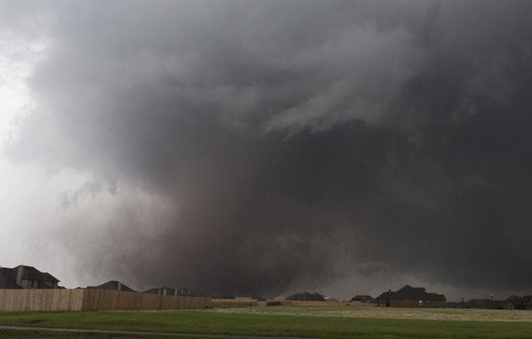 A tornado moves past homes in Moore, Okla. on Monday, May 20, 2013 with winds up to 200 mph. (Alonzo Adams/ AP)