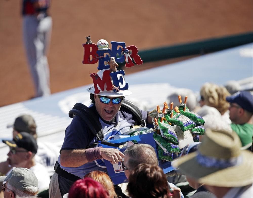 A beer vendor during an exhibition spring training baseball game between the Chicago Cubs and the Cleveland Indians Monday, March 4, 2013, in Mesa, Ariz. (Morry Gash/AP)