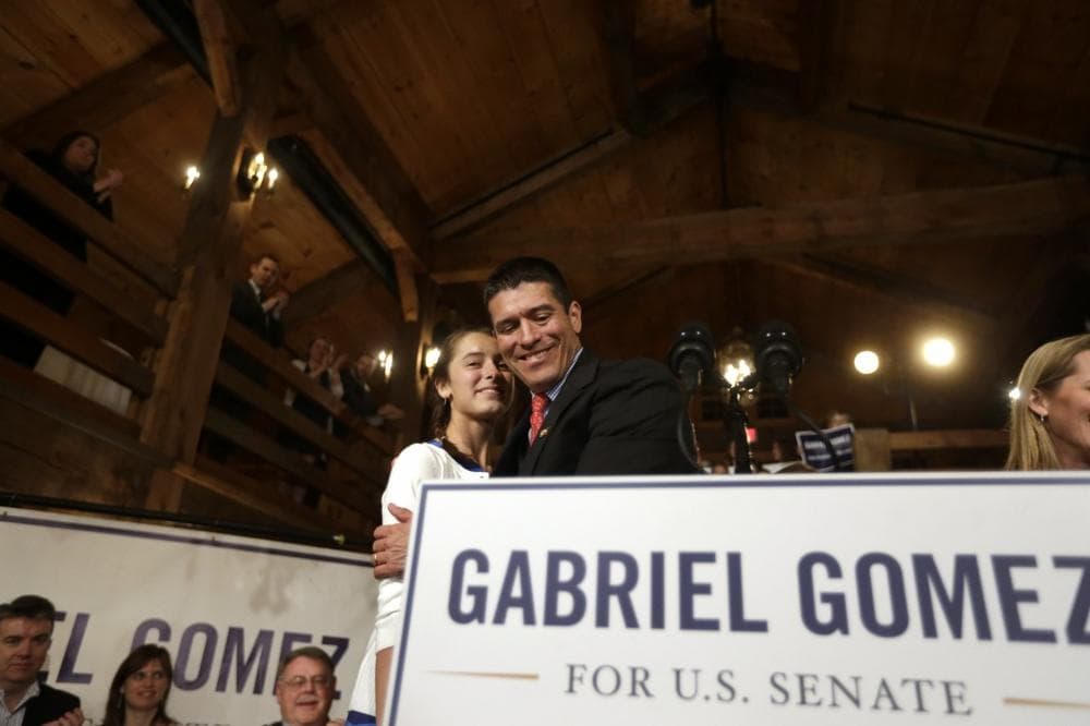 Republican candidate for the U.S. Senate Gabriel Gomez, right, hugs his daughter Olivia, 13, left, before addressing an audience with a victory speech at a watch party, in Cohasset, Mass., Tuesday, April 30, 2013. Gomez won his primary bid for the Republican nomination to contest a U.S. Senate seat, defeating Republican hopefuls Michael Sullivan and Dan Winslow. (AP Photo/Steven Senne)