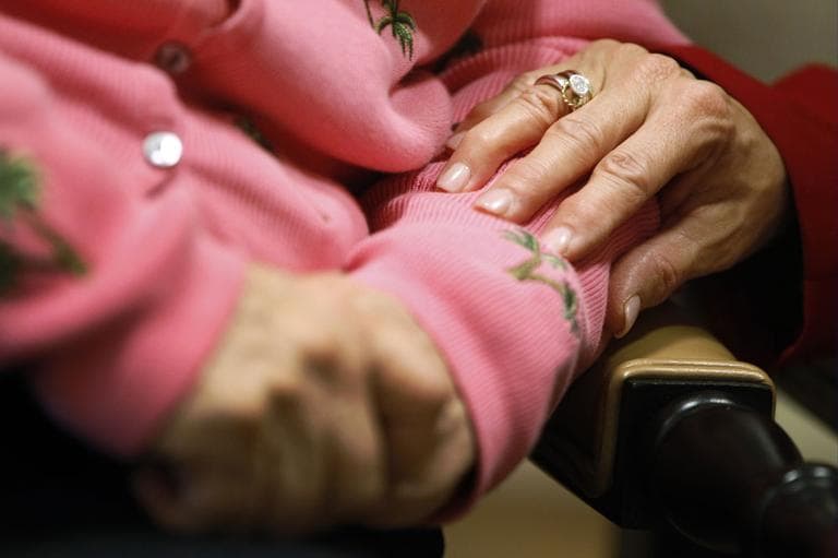 Alexis McKenzie, right, executive director of The Methodist Home of the District of Columbia Forest Side, an Alzheimer's assisted-living facility, puts her hand on the arm of resident Catherine Peake, in Washington, Monday, Feb. 6, 2012. (AP)
