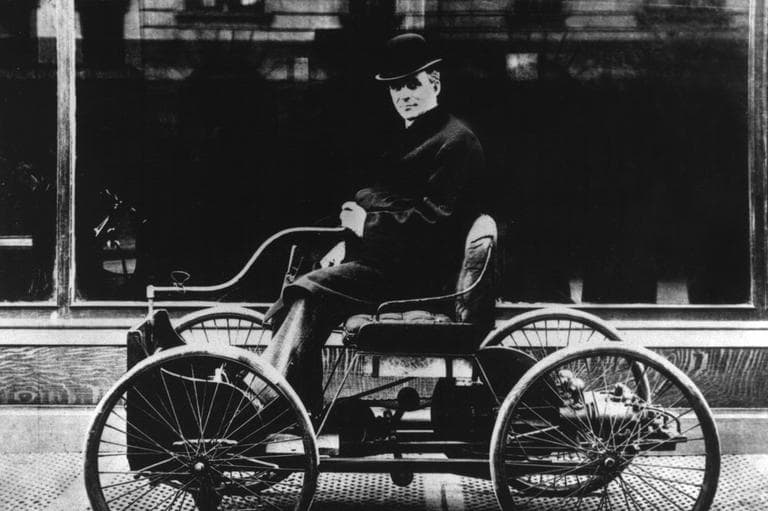 Henry Ford sits at the tiller of his first automobile, the Quadricycle, in front of the John Wanamaker salesroom on Broadway between 49th and 50th Streets in New York City in 1904. (AP)
