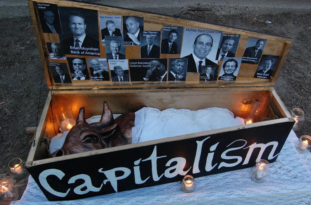 Mock coffin prop used in the 'Funeral March for Capitalism.' (Greg Cook)