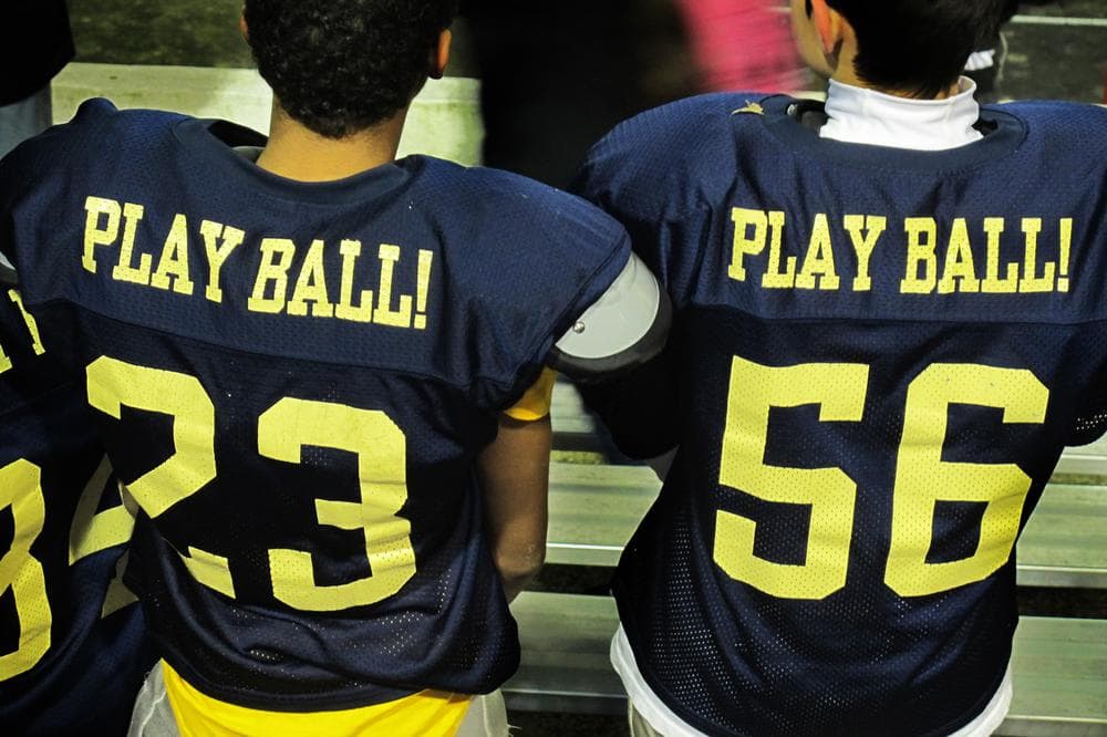 Two players during a Play Ball!-sponsored football championship game in November (Doug Tribou/WBUR)