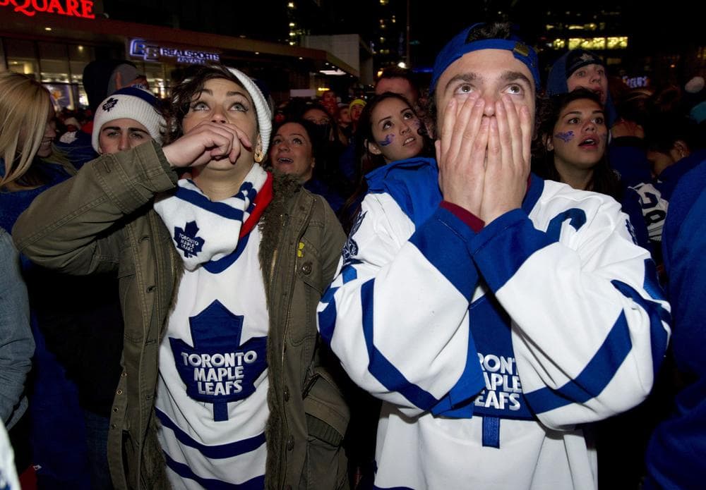 Toronto Maple Leafs fans react to the Boston Bruins' overtime game winning goal in game 7 first round NHL action while watching the game at Maple Leafs Square in Toronto on Monday May 13, 2013. (AP Photo/The Canadian Press, Frank Gunn)