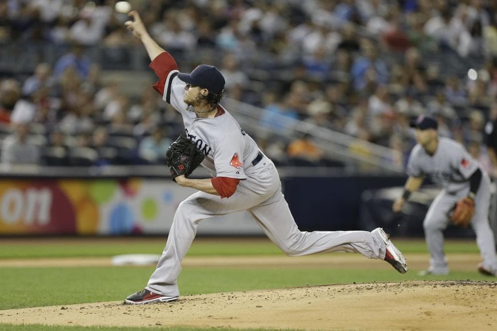 Starting pitcher Clay Buchholz delivers in the first inning against the New York Yankees in a baseball game at Yankee Stadium. (AP Photo)