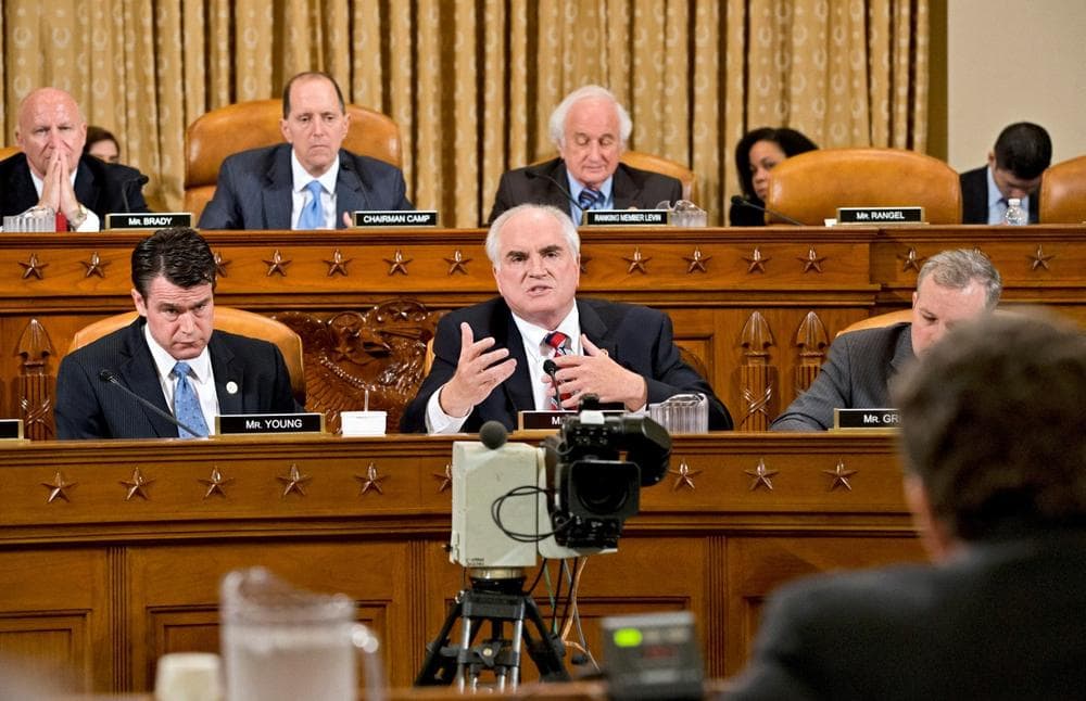 House Ways and Means Committee member Rep. Mike Kelly, R-Pa., center, questions the ousted head of the Internal Revenue Service Steven Miller, as the Republican-run committee held a hearing on the extra scrutiny the IRS gave Tea Party and other conservative groups that applied for tax-exempt status, Friday, May 17, 2013, on Capitol Hill in Washington. (J. Scott Applewhite/AP)