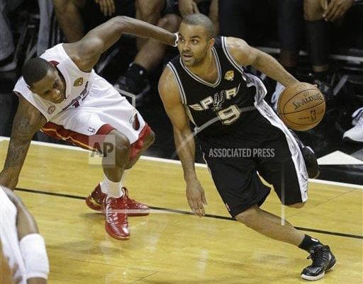 Tony Parker scored a game-high 21 points to lead the San Antonio Spurs past the Miami Heat in Game 1 of the NBA Finals. (Wilfredo Lee/AP) 