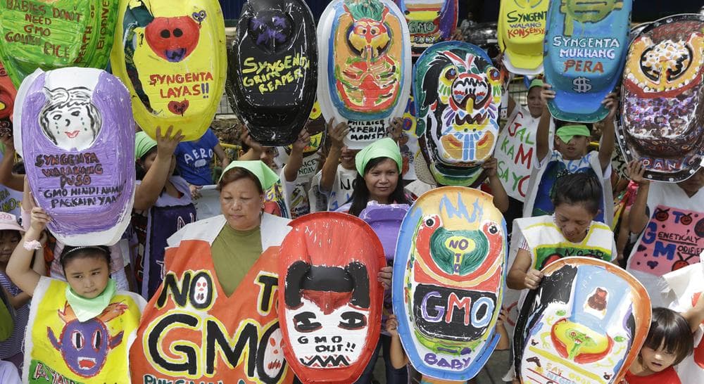 Mothers and children display painted baby tubs which they themselves designed during a protest on World Environment Day Wednesday June 5, 2013 at suburban Quezon city northeast of Manila, Philippines. (Bullit Marquez/AP)