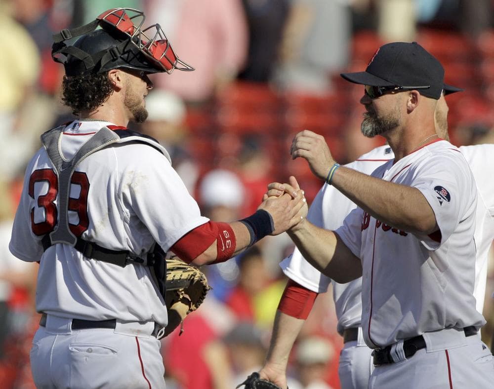 Red Sox catcher Jarrod Saltalamacchia (39) is congratulated by David Ross after their 10-5 win over the Los Angeles Angels in a baseball game, Sunday, June 9, 2013 at Fenway Park in Boston. (AP/Mary Schwalm)