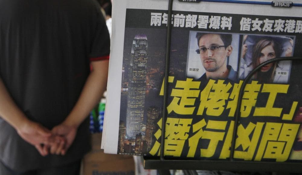 A picture of Edward Snowden, a former CIA employee who leaked top-secret documents about sweeping U.S. surveillance programs, is displayed on the front page of a newspaper in Hong Kong Wednesday, June 12, 2013. (Kin Cheung/AP)