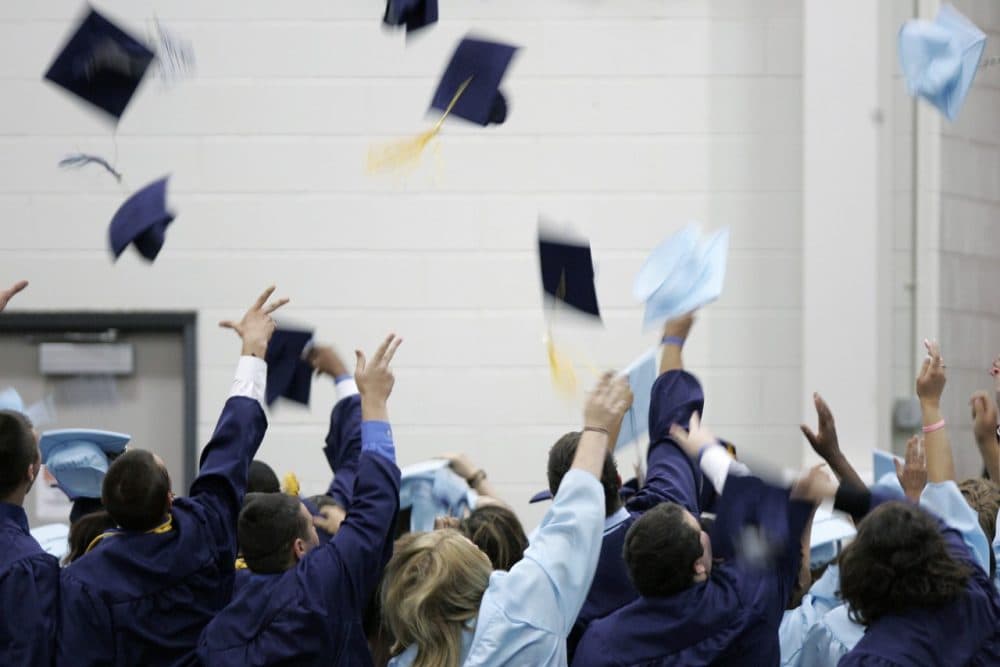 Lake High School graduates throw their caps into the air, Tuesday, June 8, 2010, at Owens Community College in Perrysburg, Ohio. (J.D. Pooley/AP)