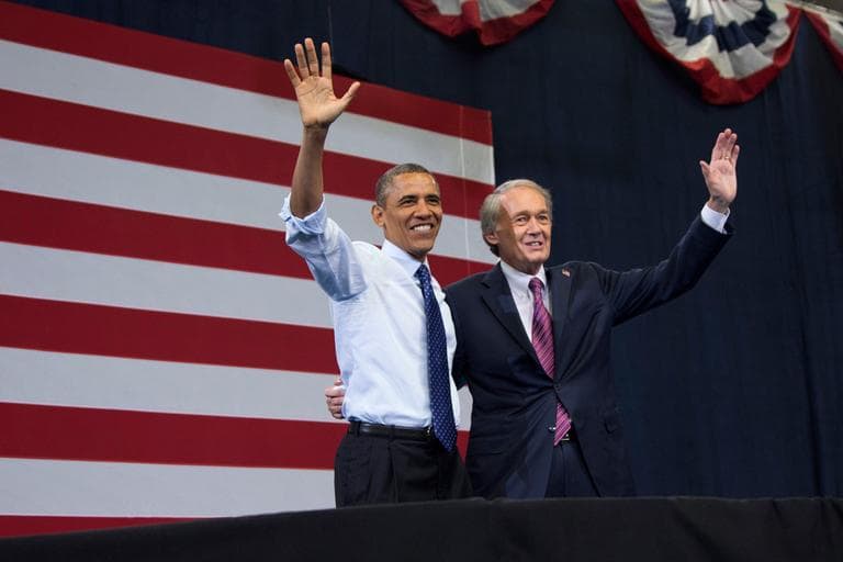 President Obama and Democratic Senate candidate Edward Markey wave to the crowd during a campaign rally for Markey in Boston Wednesday. (Evan Vucci/AP)