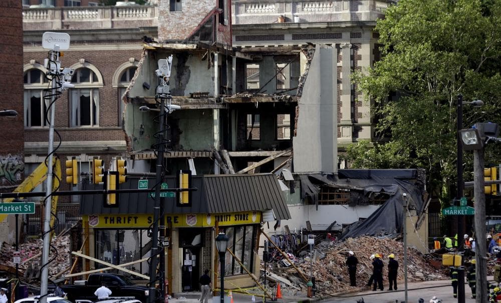 Firefighters view the aftermath of a building collapse, Thursday, June 6, 2013, in Philadelphia. (Matt Rourke/AP)