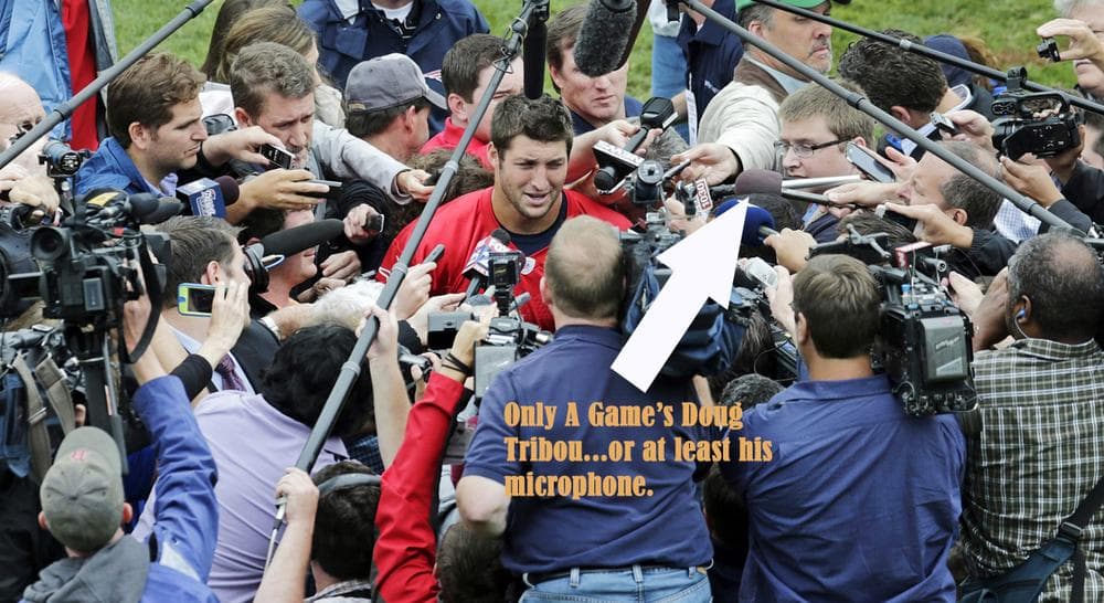 Tim Tebow takes questions after his first day of mini-camp with the New England Patriots. Only A Game's Doug Tribou had an obstructed view of the proceedings.