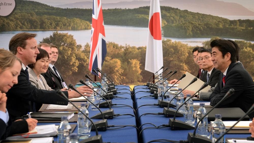 Japan's Prime Minister Shinzo Abe, right, meets with Britain's Prime Minister David Cameron, second left, at the G8 Summit in Eniskillen, Northern Ireland, Monday June 17, 2013. (Stefan Rousseau/AP)