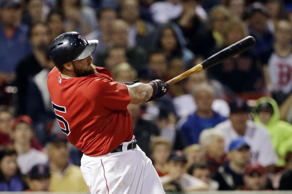 Boston Red Sox's Jonny Gomes follows through on his two-RBI walk-off home run during the ninth inning of the second game in a day-night doubleheader. (AP /Elise Amendola)
